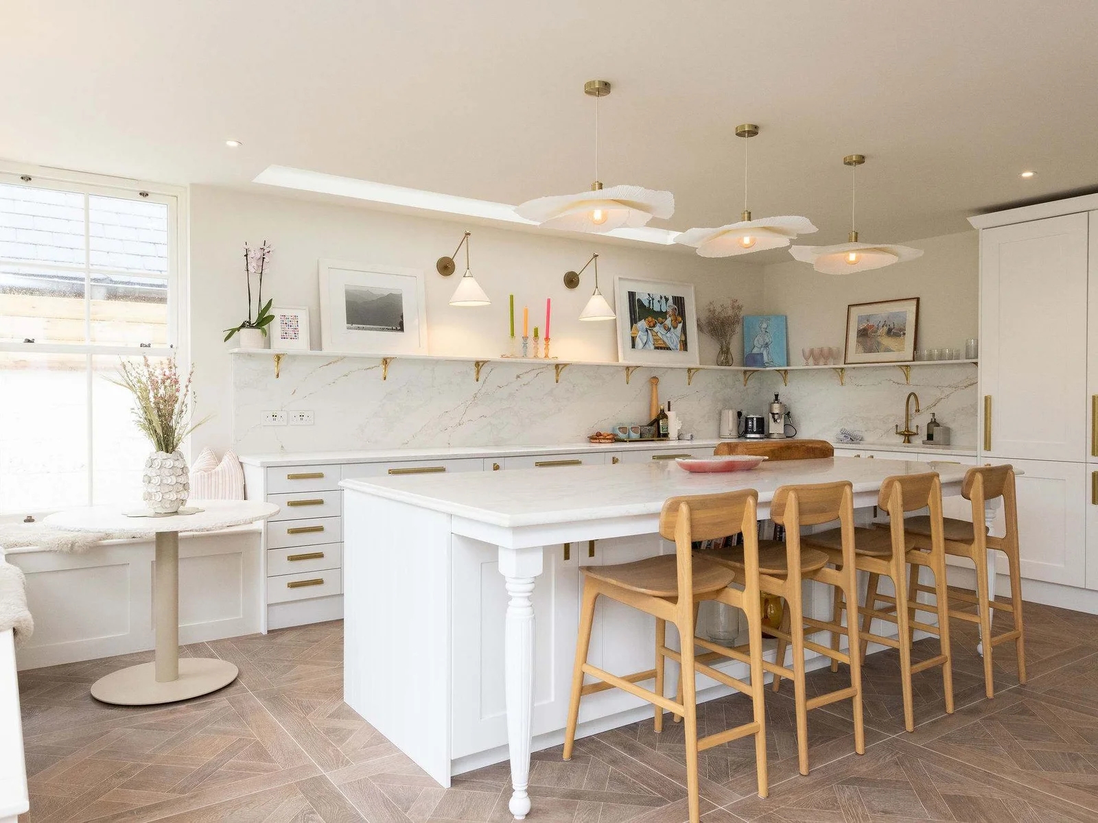 Gather around the sun-drenched island in this stunning, open-plan kitchen.