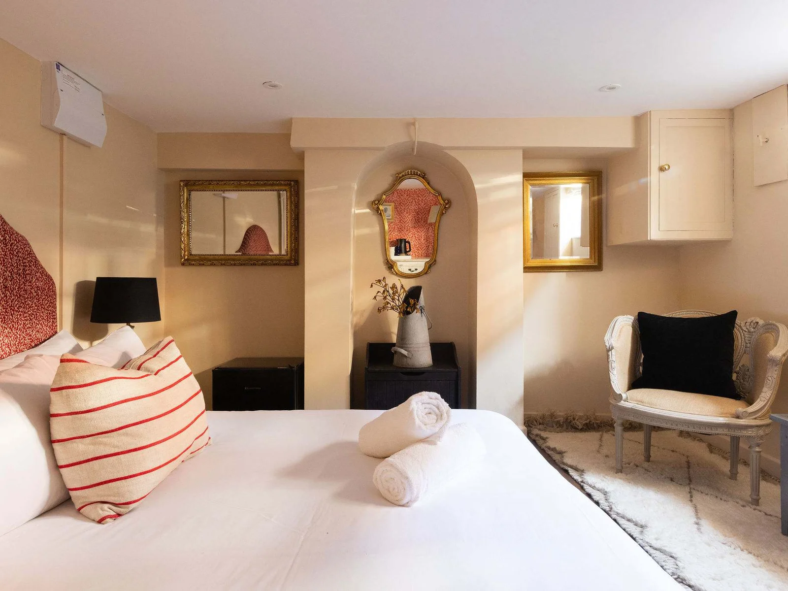 Elegant bedroom with warm, characterful interiors