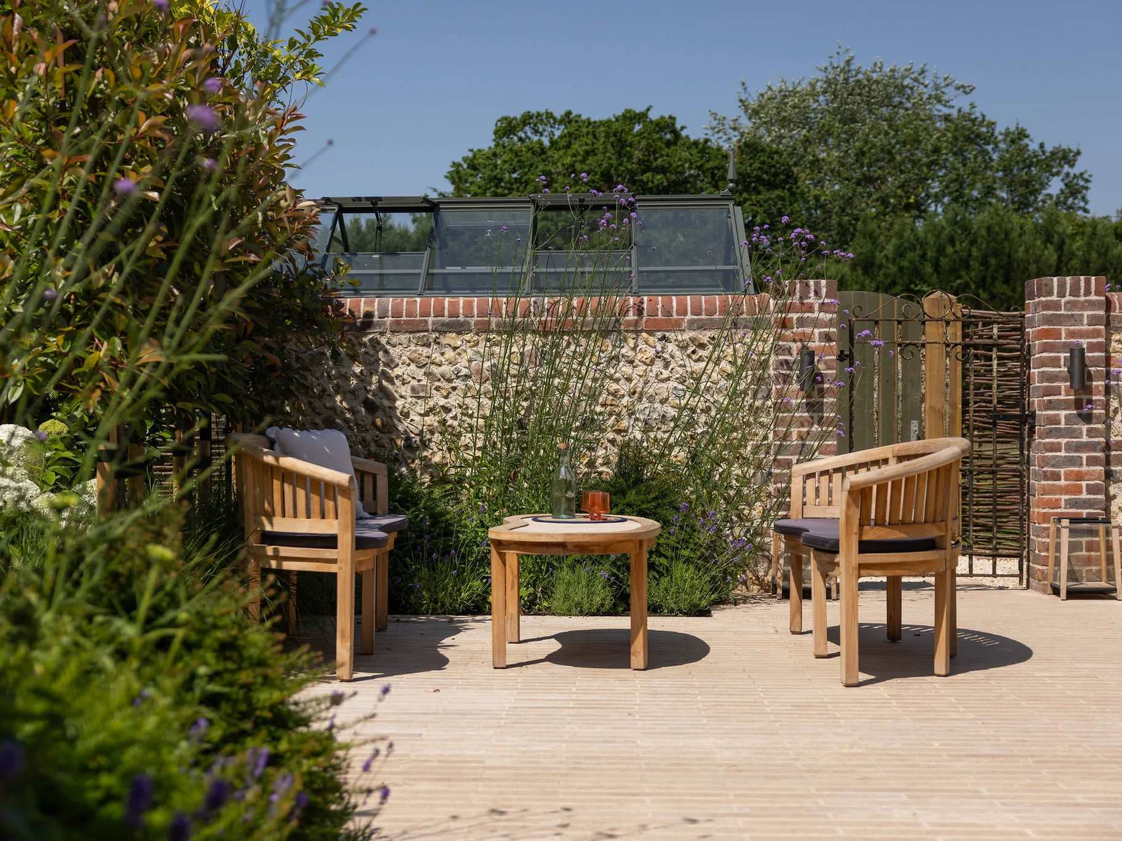 Quiet terrace seating area surrounded by greenery, ideal for peaceful moments outdoors