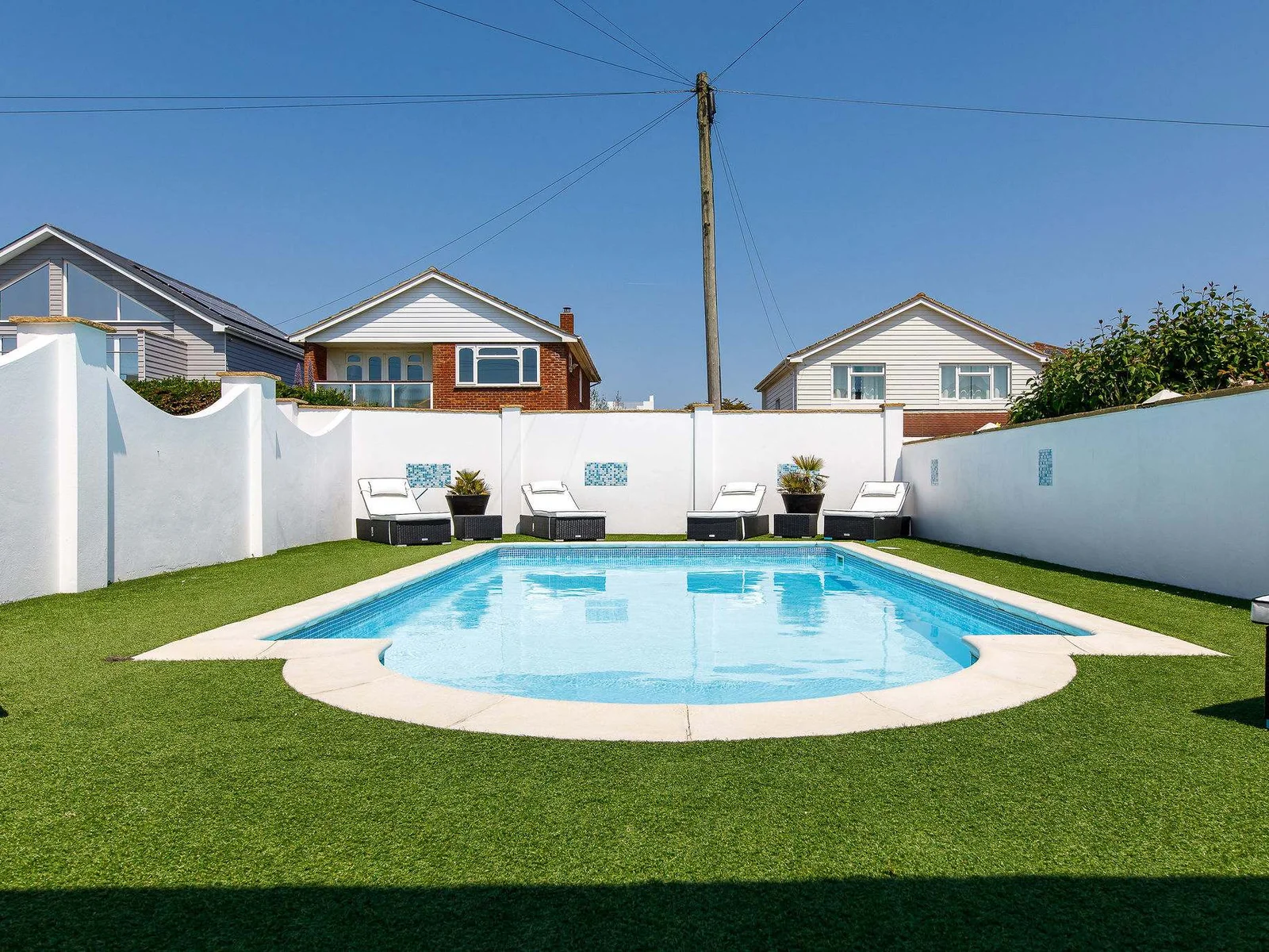 Cool off in the pool...or maybe just set yourself up on one of the sun loungers.