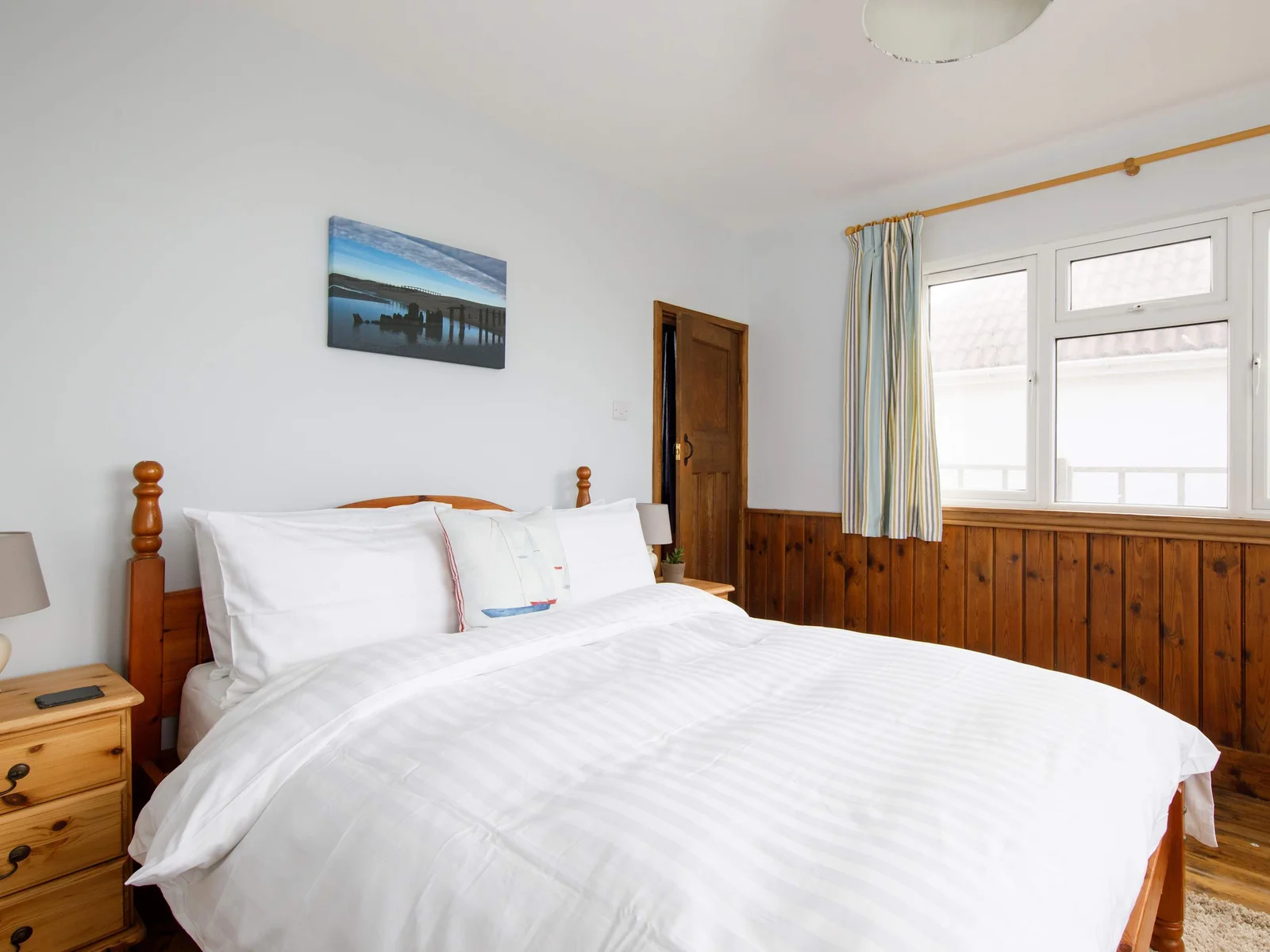 The ground floor features a total of four bedrooms