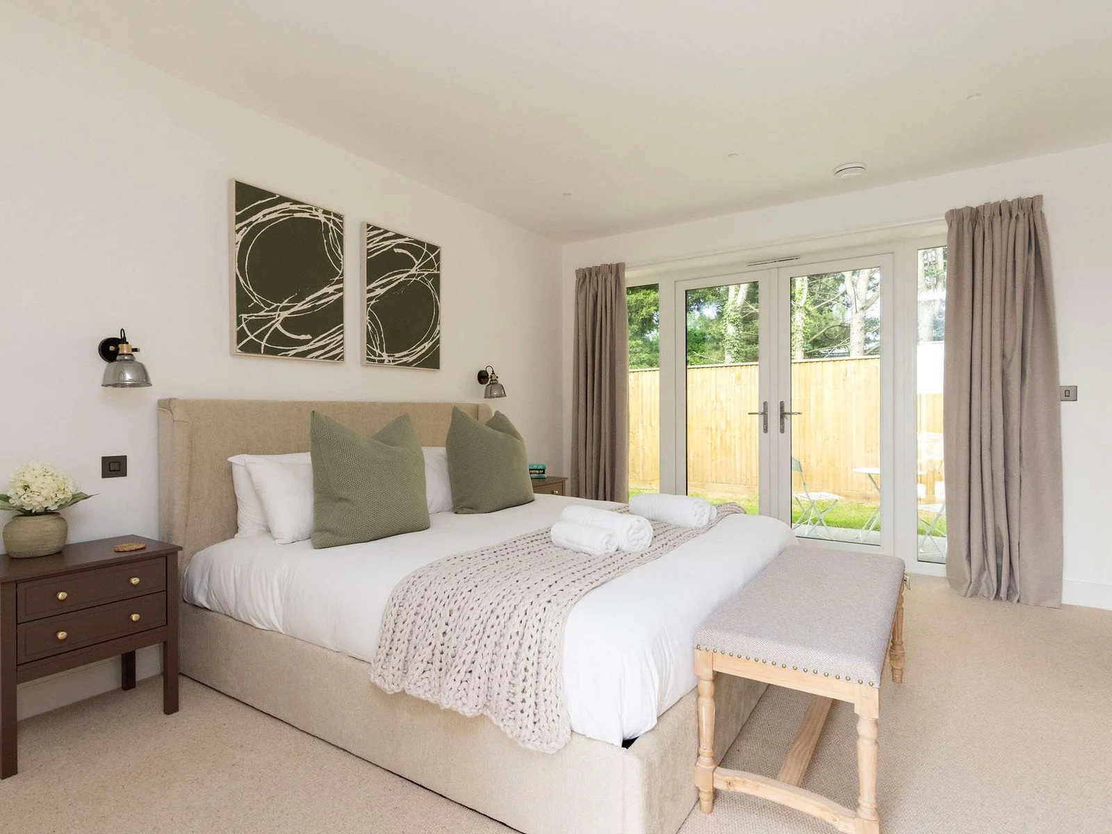 Comfortable bedroom with garden access and natural light