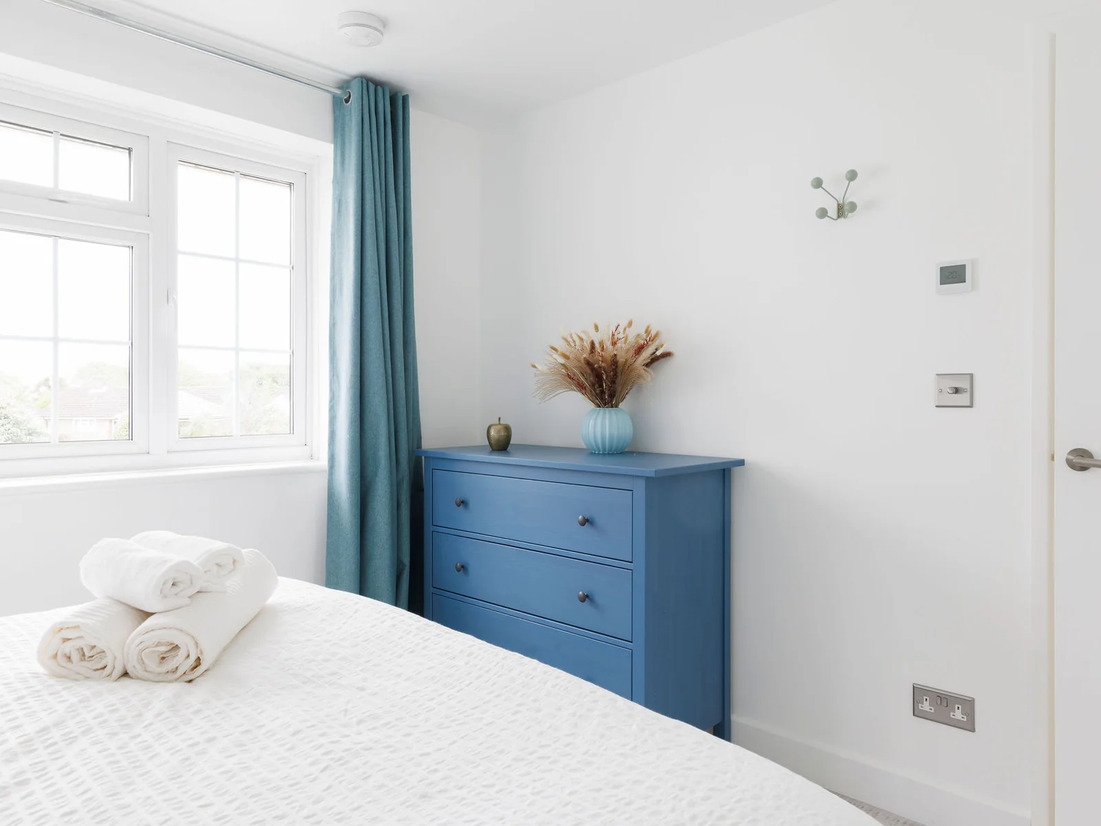 Bright bedroom with ample storage space and minimalist decor