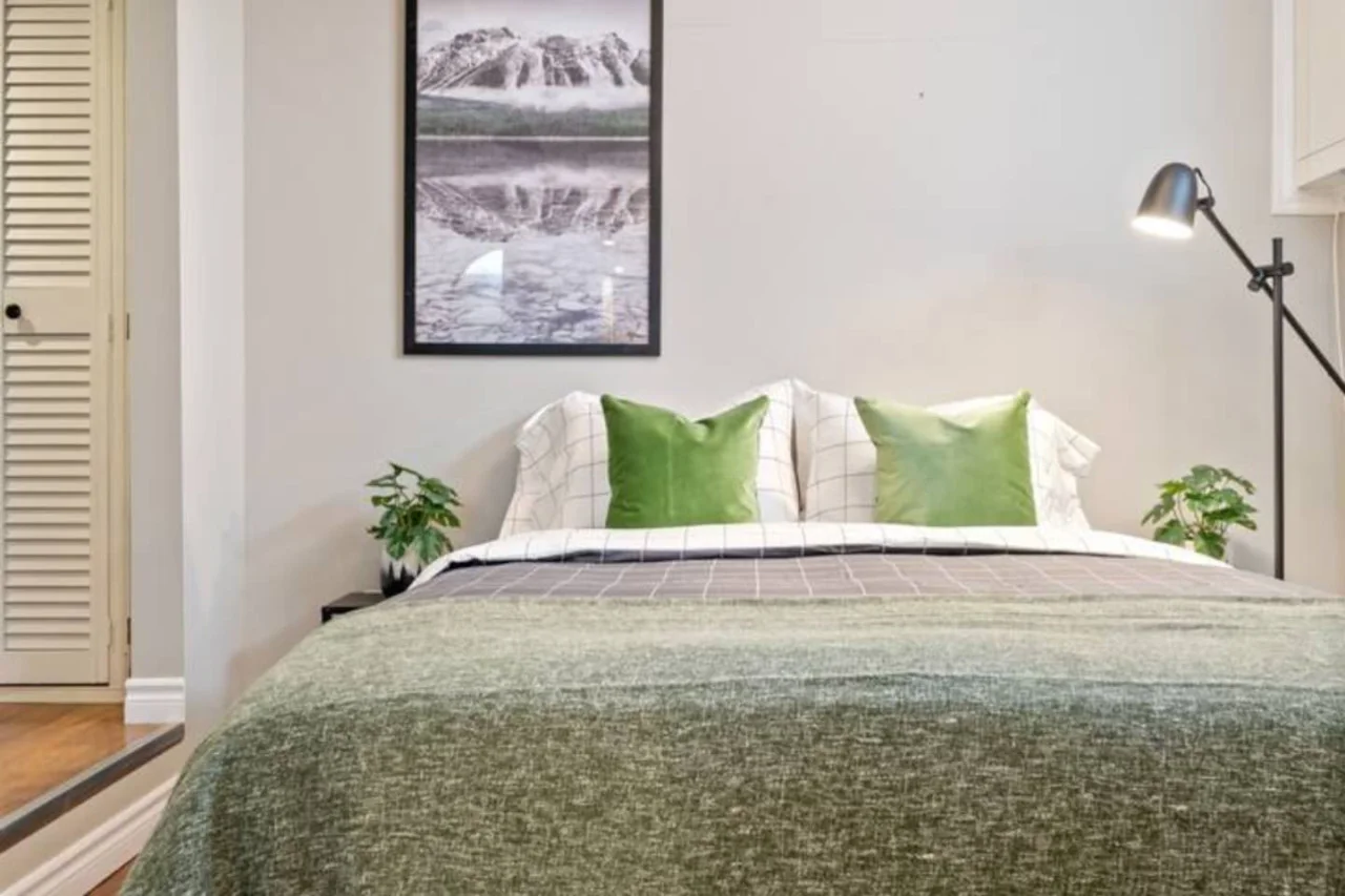 The bedroom’s serene ambiance invites you to relax, with a plush bed that promises a restful night's sleep.