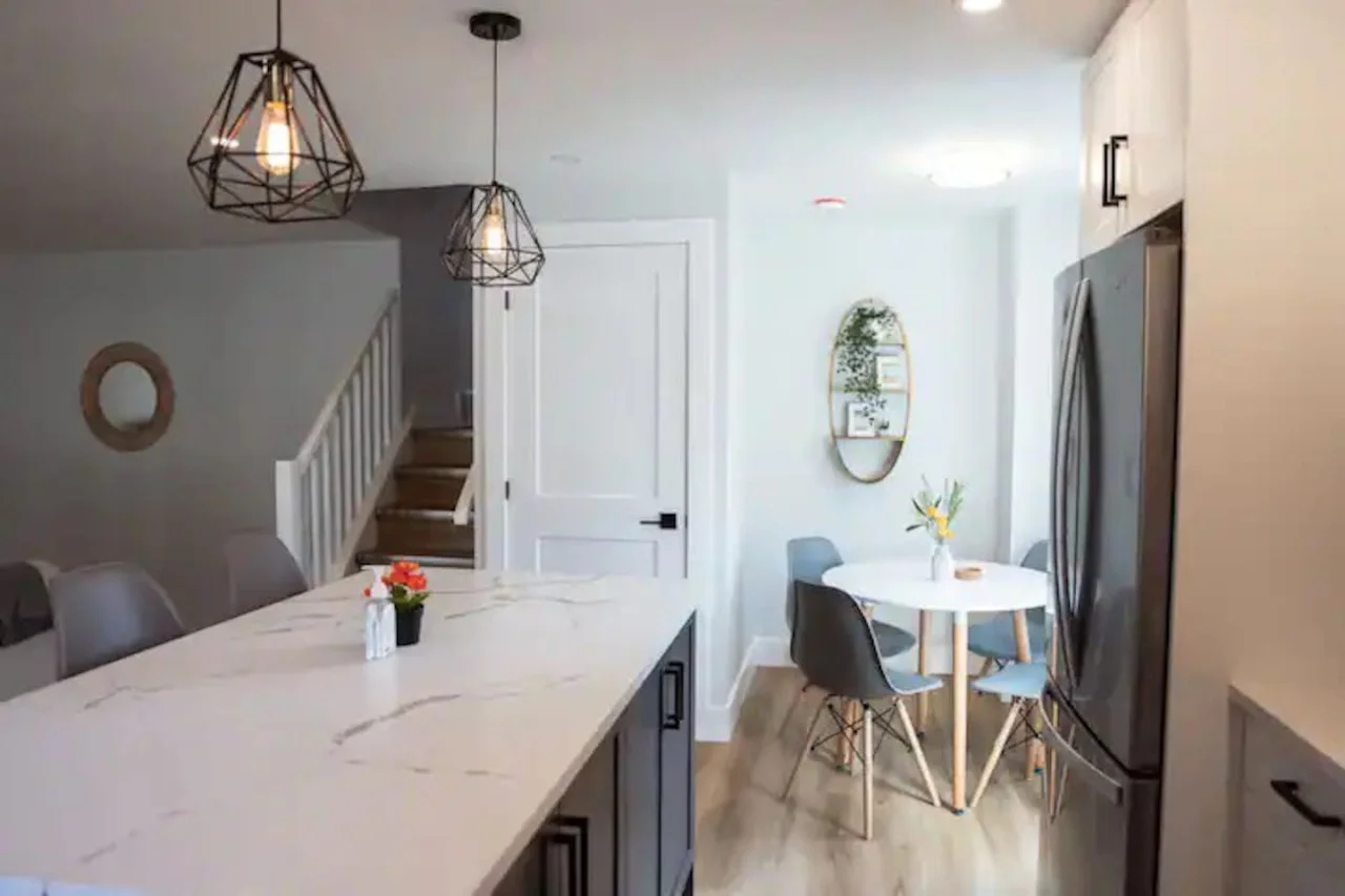 An open-concept area featuring a modern furnishings, and a stylish entertainment setup—ideal for gatherings and relaxation.