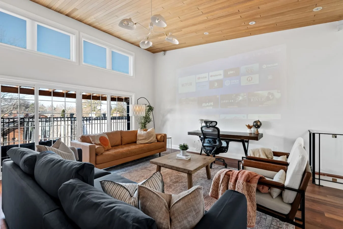 The living room’s cozy vibe makes it the perfect spot to relax, with ample seating and a warm ambiance.