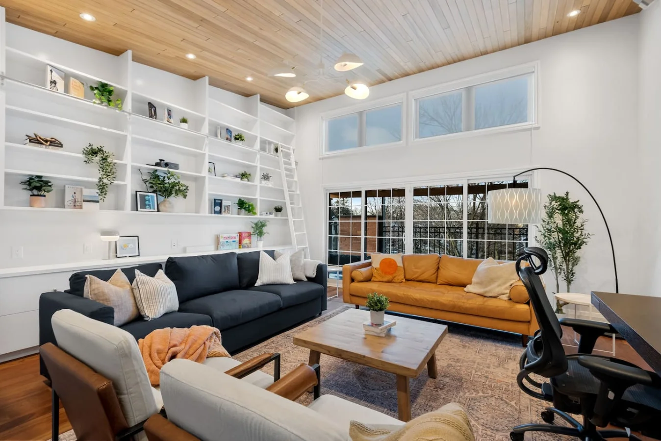 The living room is filled with natural light, creating a bright and welcoming space that invites relaxation.