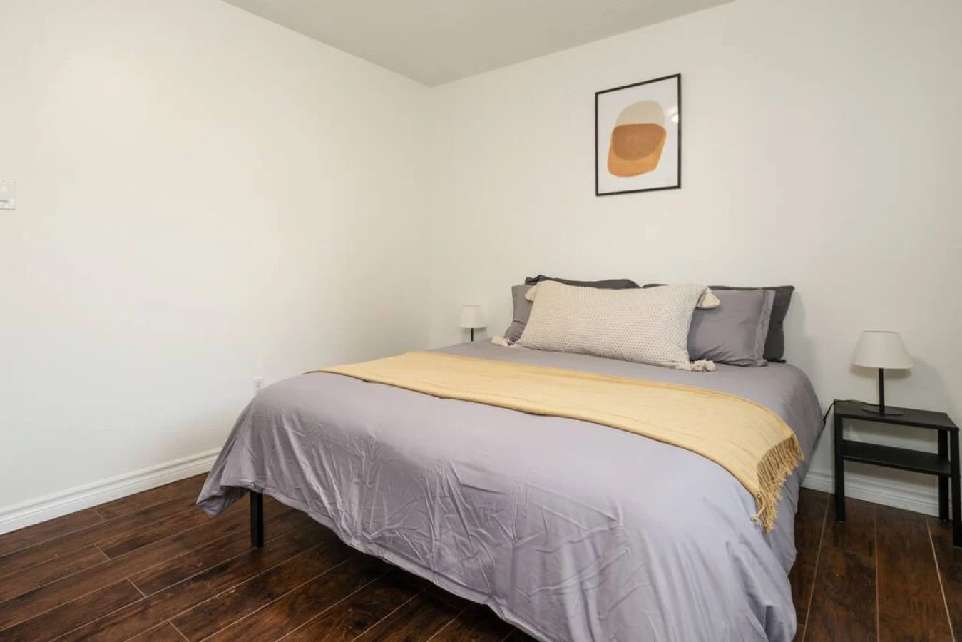 Cozy bedroom with nightstands and blindsQueen bed that sleeps 2. Memory foam mattress with comfort in mind