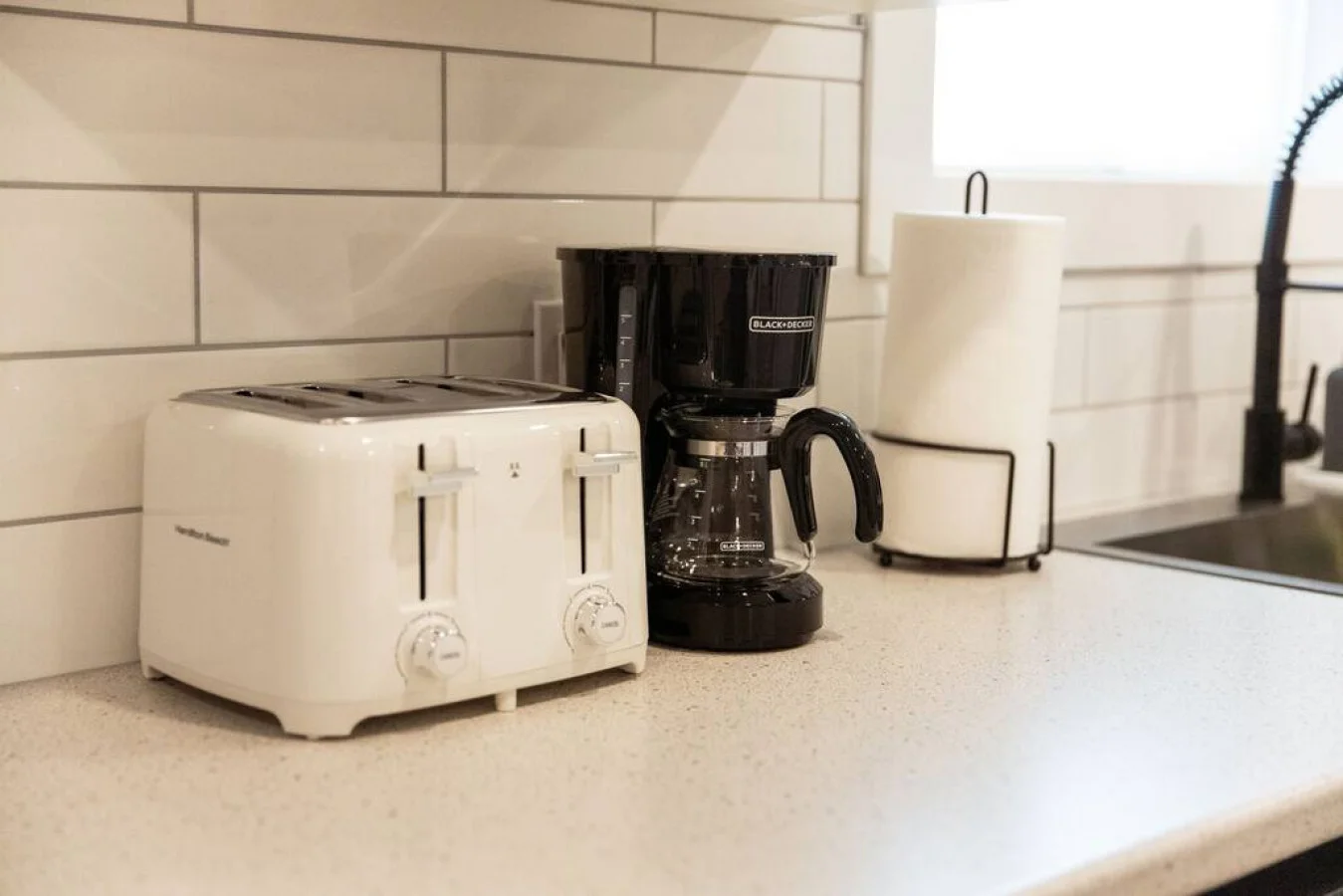 The coffee station is thoughtfully equipped with a variety of in-house consumables, including a selection of ground coffee, sweeteners, and creamers to suit every taste.