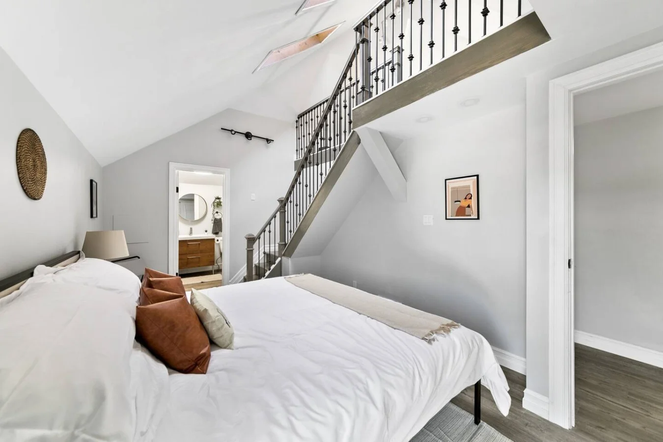 The bedroom’s serene ambiance invites you to relax, with a plush bed that promises a restful night's sleep.