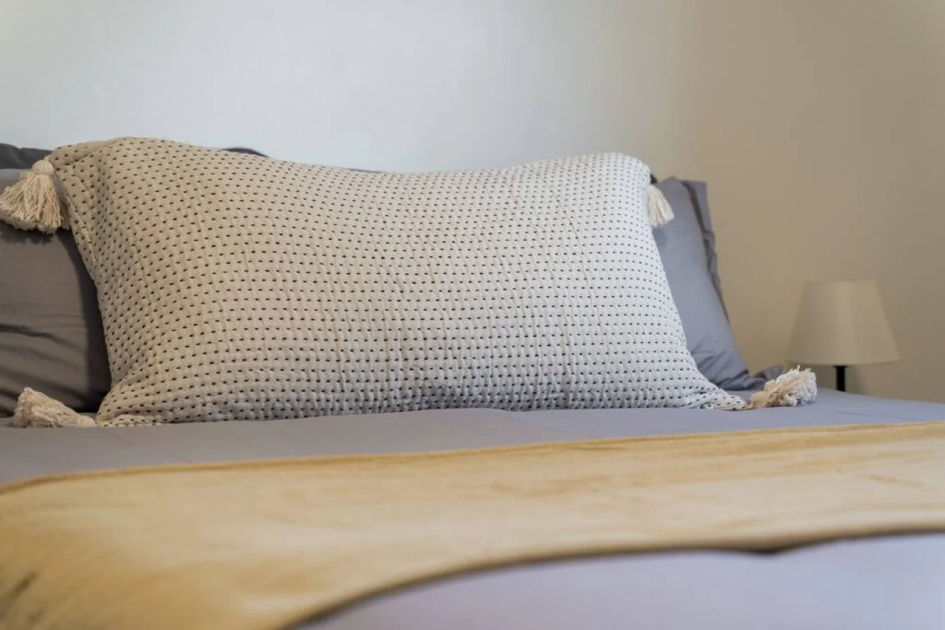 The bedroom offers a luxurious retreat, with a bed that promises restful nights and a room that feels like a private oasis.