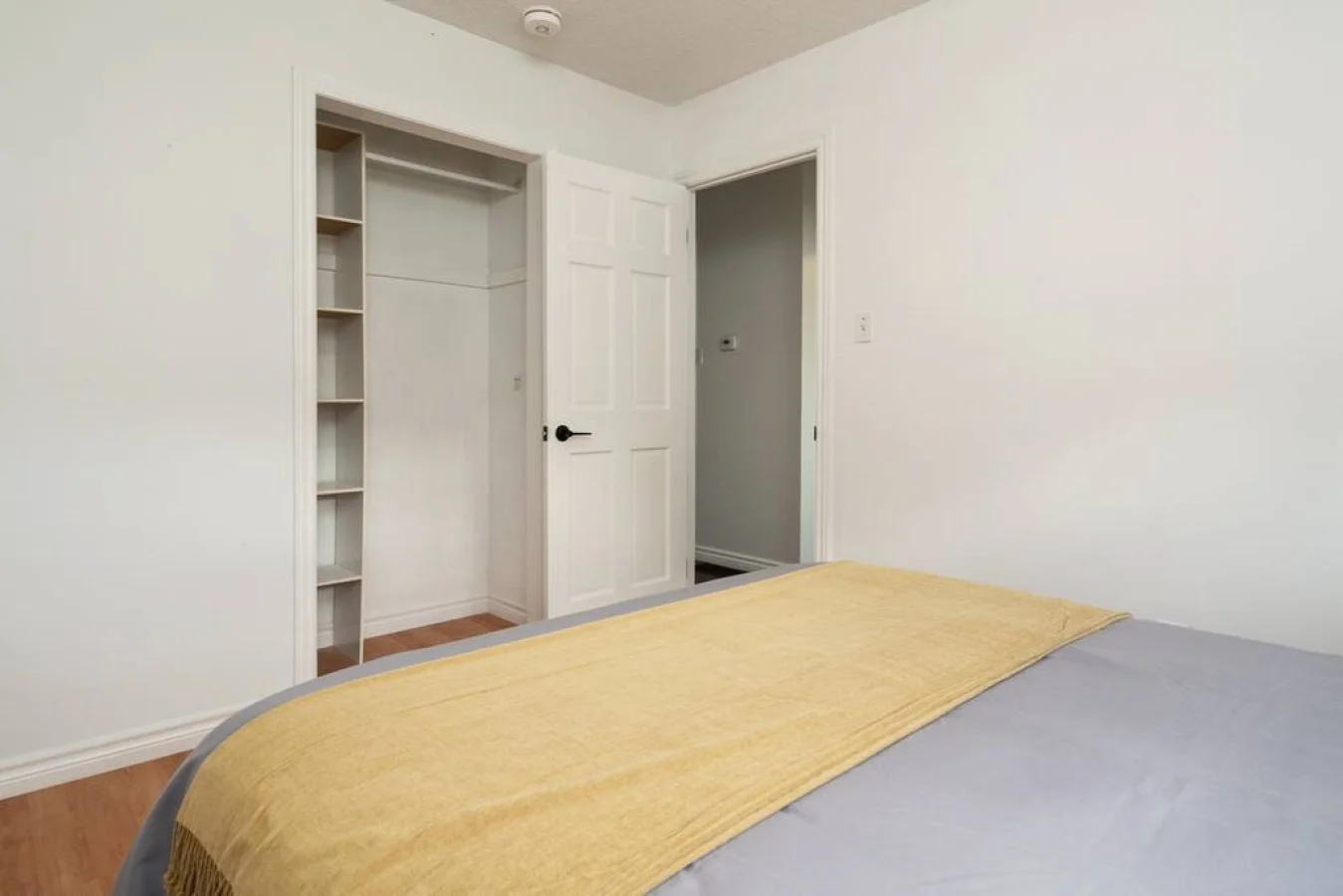 Luxurious bedroom featuring a comfortable bed, elegant decor, and plenty of natural light for a rejuvenating sleep.