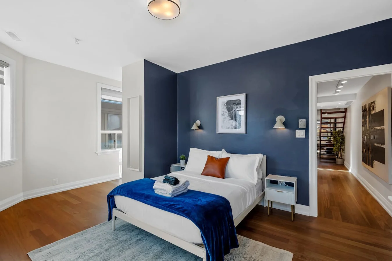 The bedroom offers a luxurious retreat, with a bed that promises restful nights and a room that feels like a private oasis.