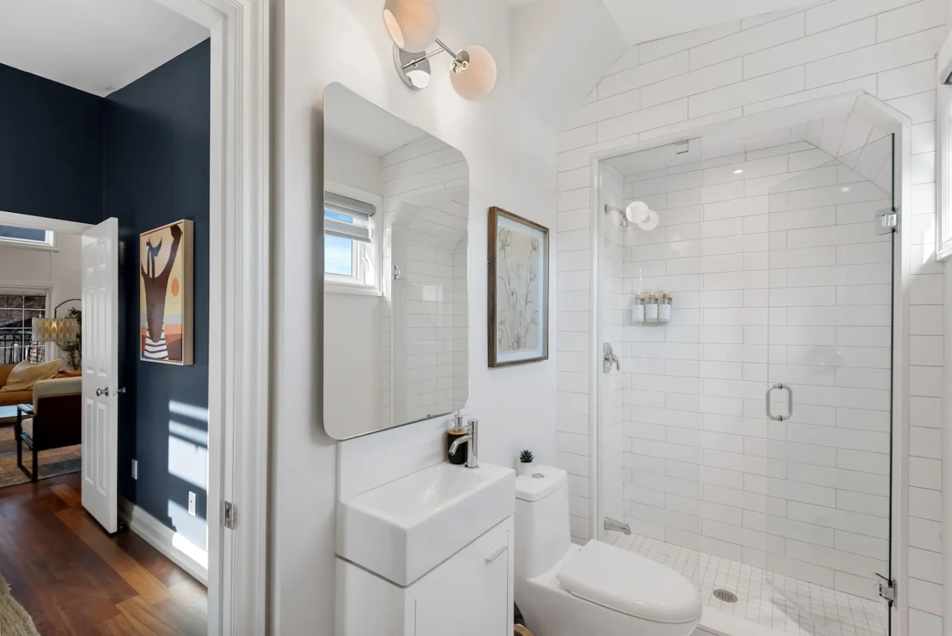 You feel a sense of calm as you enter the bathroom, where the thoughtful design and high-quality materials create a serene environment.