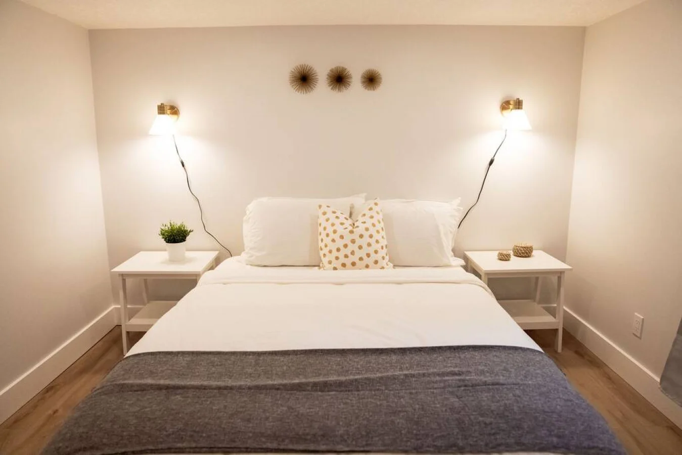 You feel enveloped in comfort as you relax on the queen bed, surrounded by a room designed for tranquility.