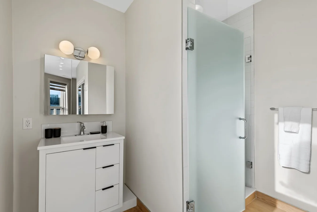 You feel a sense of calm as you enter the bathroom, where the thoughtful design and high-quality materials create a serene environment.