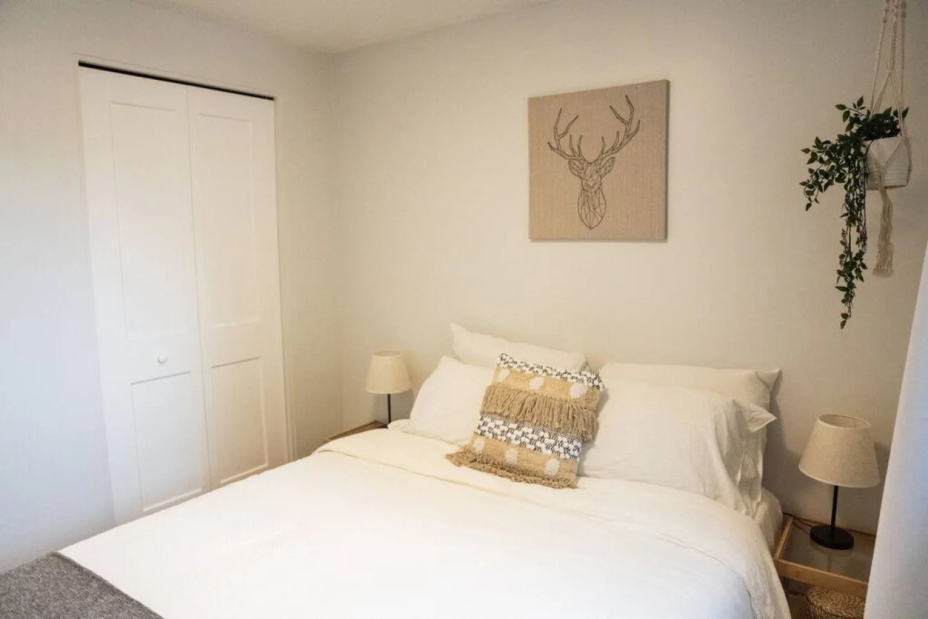 You feel enveloped in comfort as you relax on the queen bed, surrounded by a room designed for tranquility.