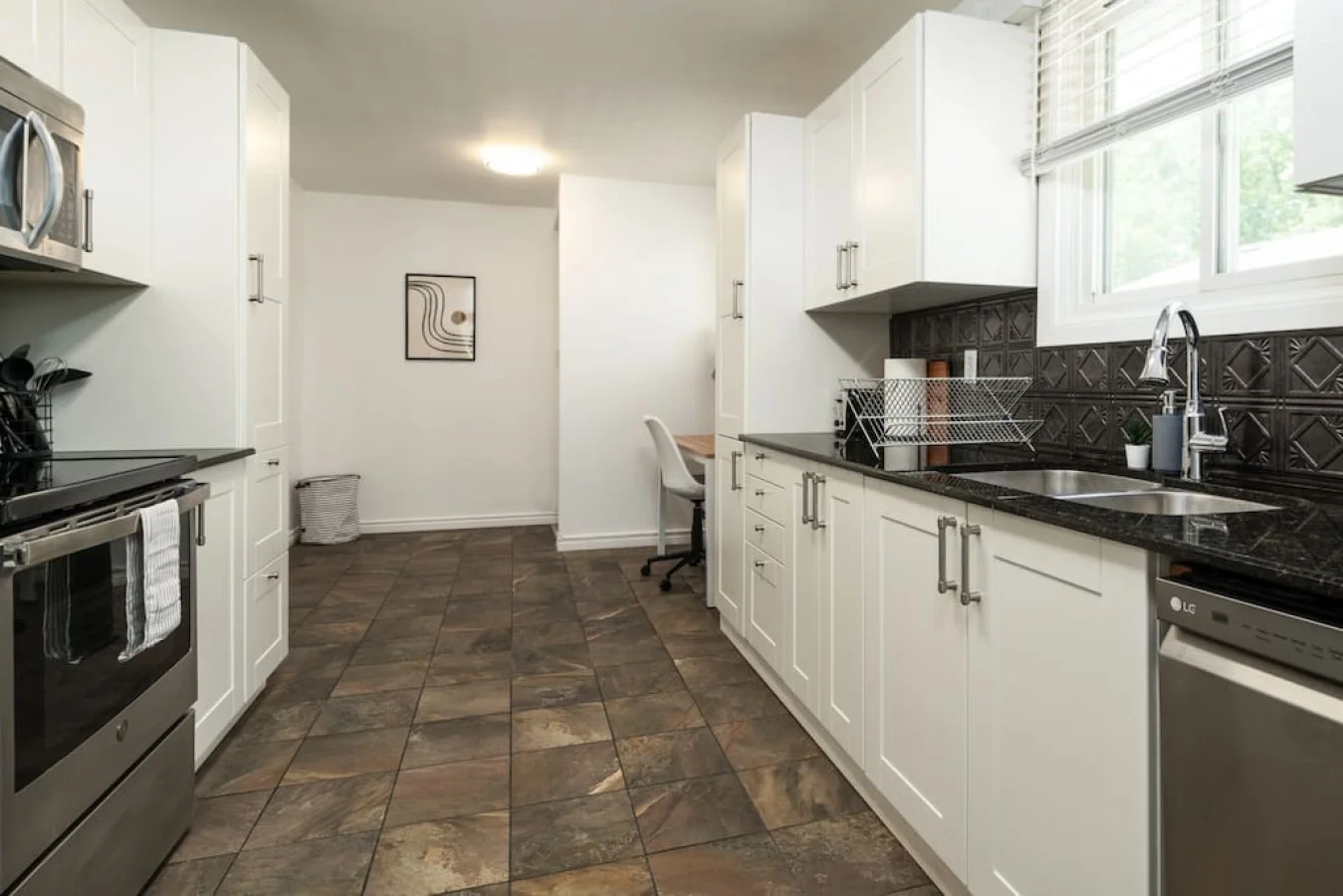 As you approach kitchen the elegant layout and well-stocked shelves make it the ideal spot to relax.