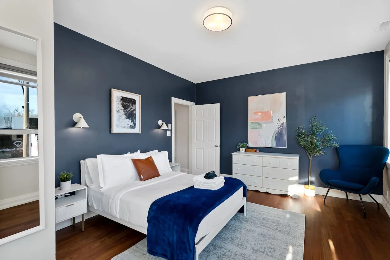 The bedroom’s serene ambiance invites you to relax, with a plush bed that promises a restful night's sleep.