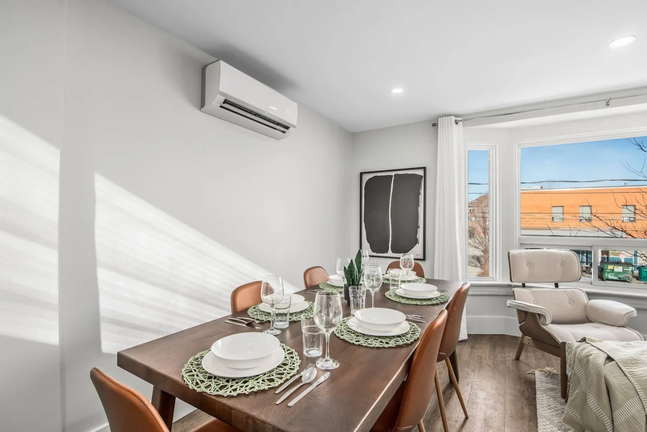 The dining room is bathed in natural light, creating a bright and inviting space where every meal feels special.