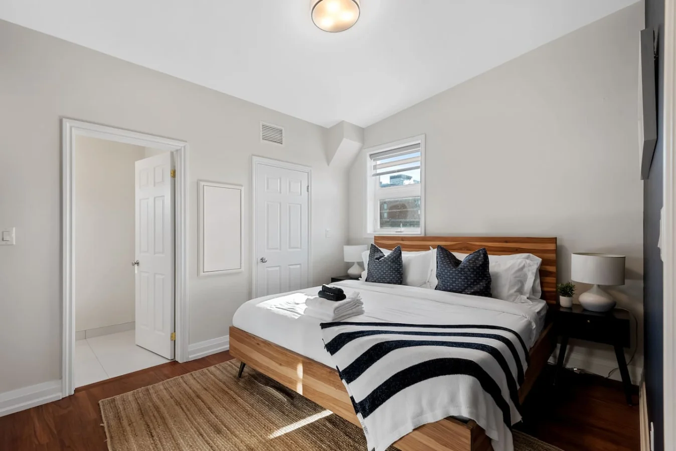 The bedroom offers a luxurious retreat, with a bed that promises restful nights and a room that feels like a private oasis.