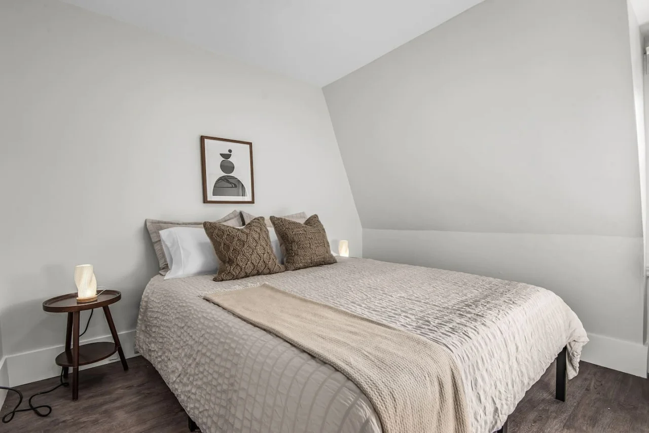 The bedroom’s serene ambiance invites you to relax, with a plush bed that promises a restful night's sleep.