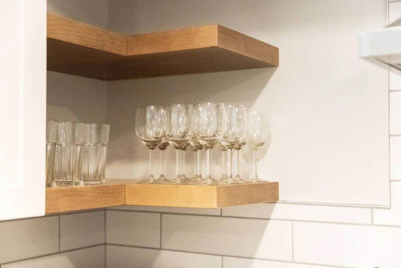 Kitchen cabinets stocked with cooking wares, glassware and silverwares, ideal for mixing up your favorite meals and drinks during your stay.