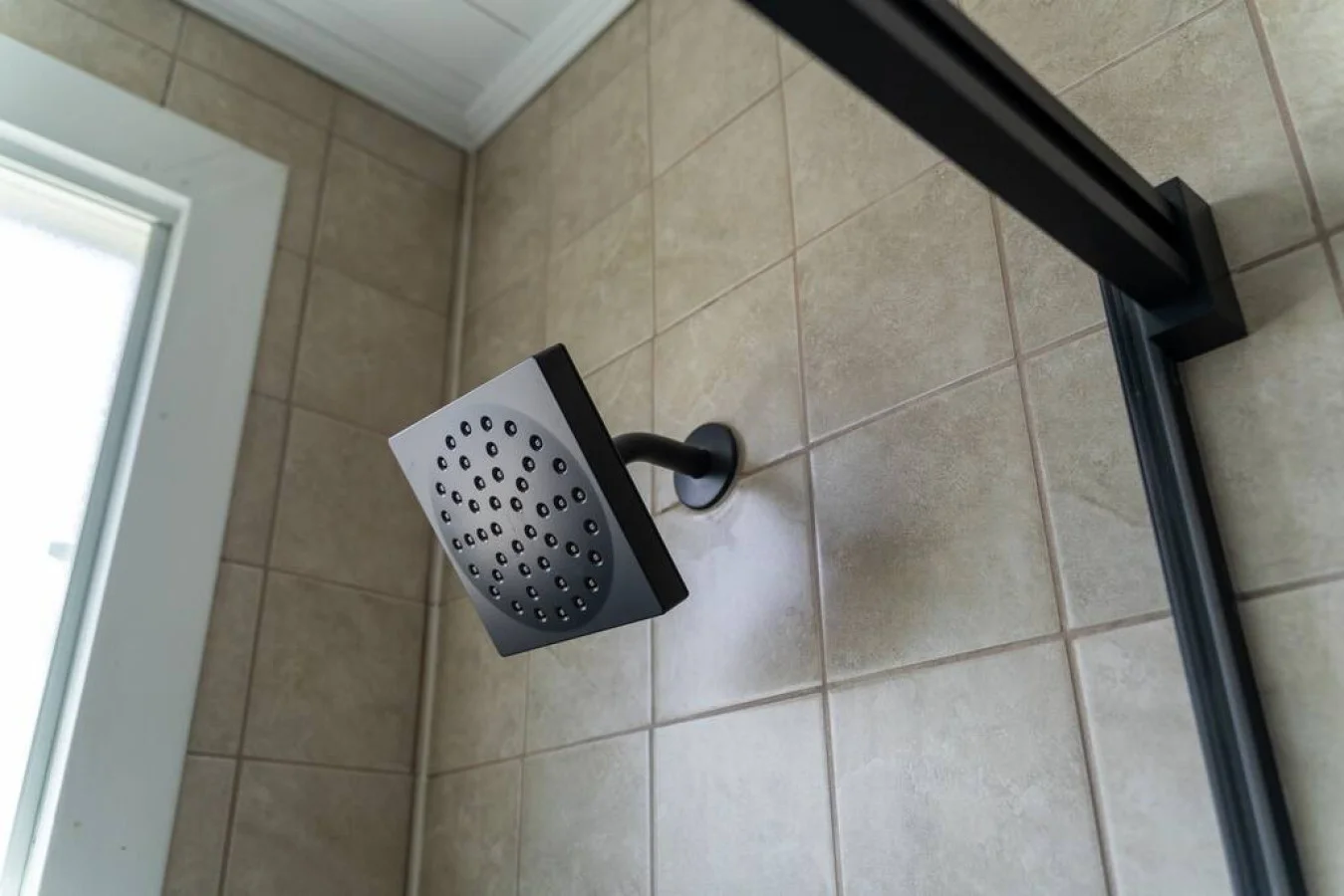 Immaculate bathroom featuring a spacious shower, fresh towels, and complimentary toiletries for a spa-like experience.