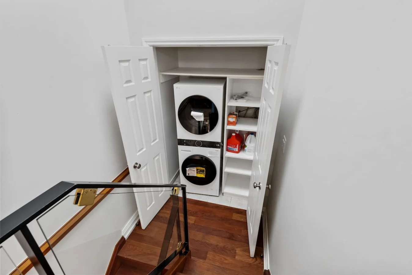 As you step into the laundry room, the modern appliances and ample storage space make it easy to keep things tidy.