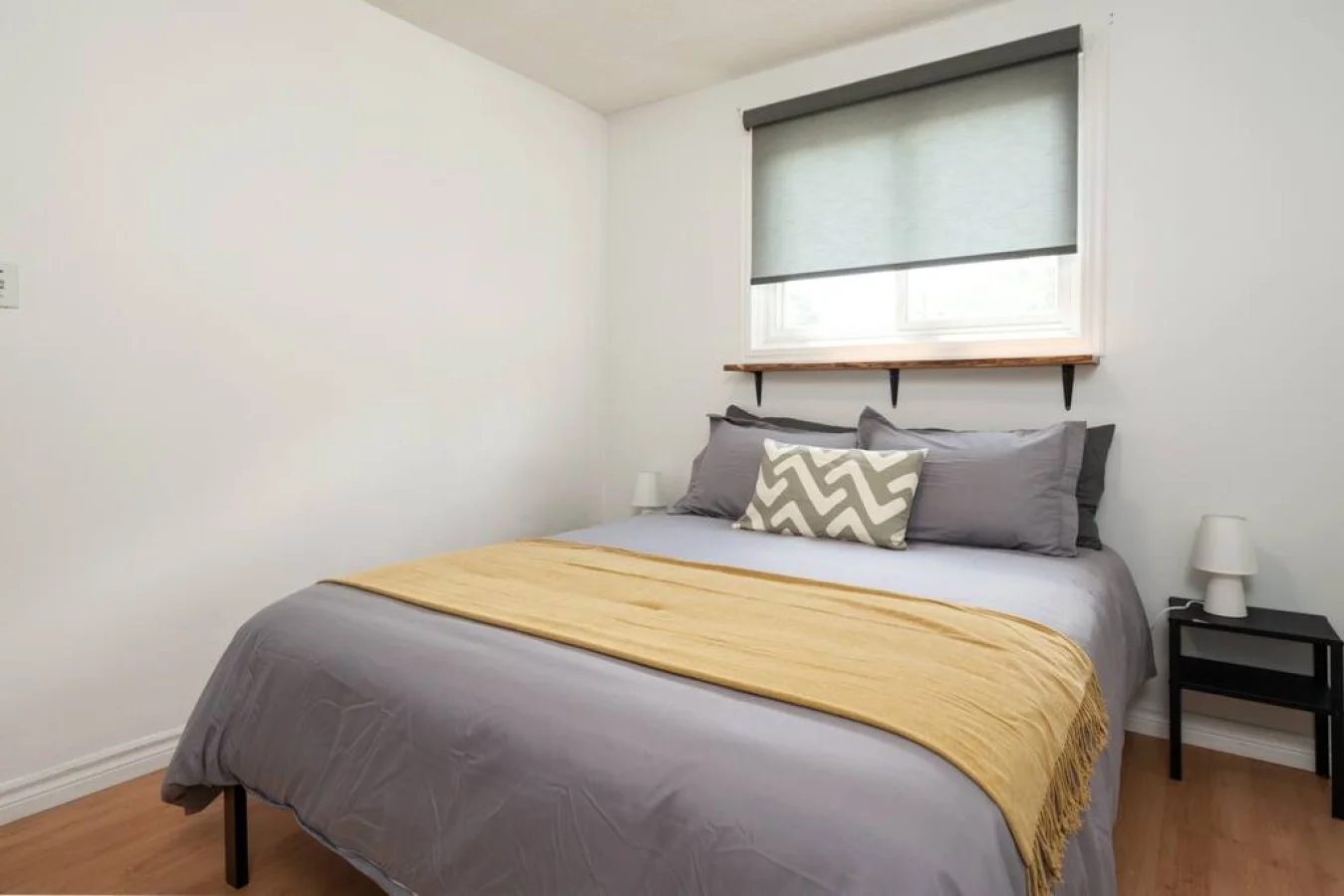 Cute spacious bedroom with queen bed that sleeps 2. Memory foam mattress with comfort in mindCozy bedroom with nightstands and blindsComfortable pillows with new sheetsDecorative pillows and throw