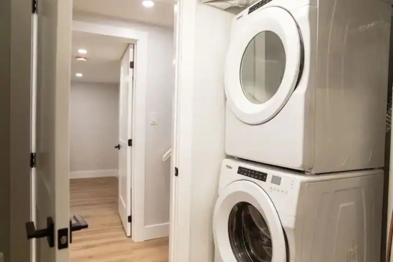 Convenient laundry room with washer, dryer, and all necessary supplies, making it easy to take care of your laundry needs.