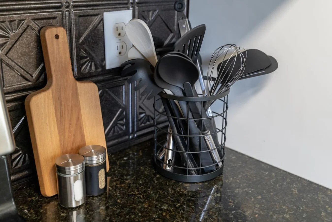 Kitchen utensils with scissors, measuring cups, grater, wine opener, can opener