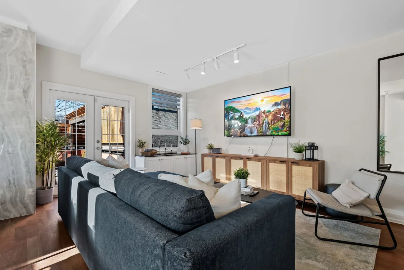 Relax in this warm, inviting space with wooden accents and cozy furnishings. You’ll love unwinding on the plush sofa, enjoying a good book or streaming your favorite shows in a serene atmosphere