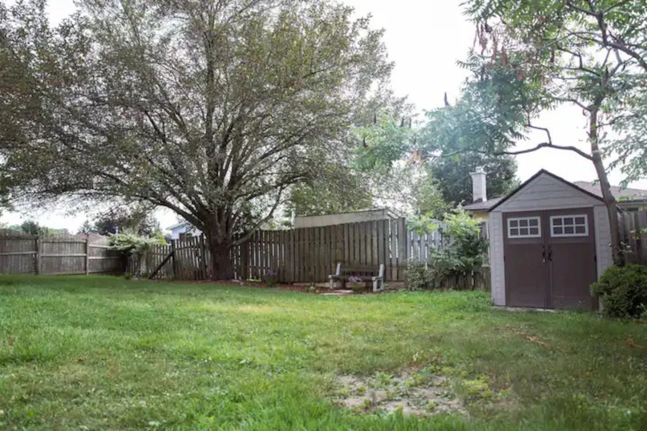 The backyard porch is filled with natural light, creating a bright and welcoming space that invites relaxation.