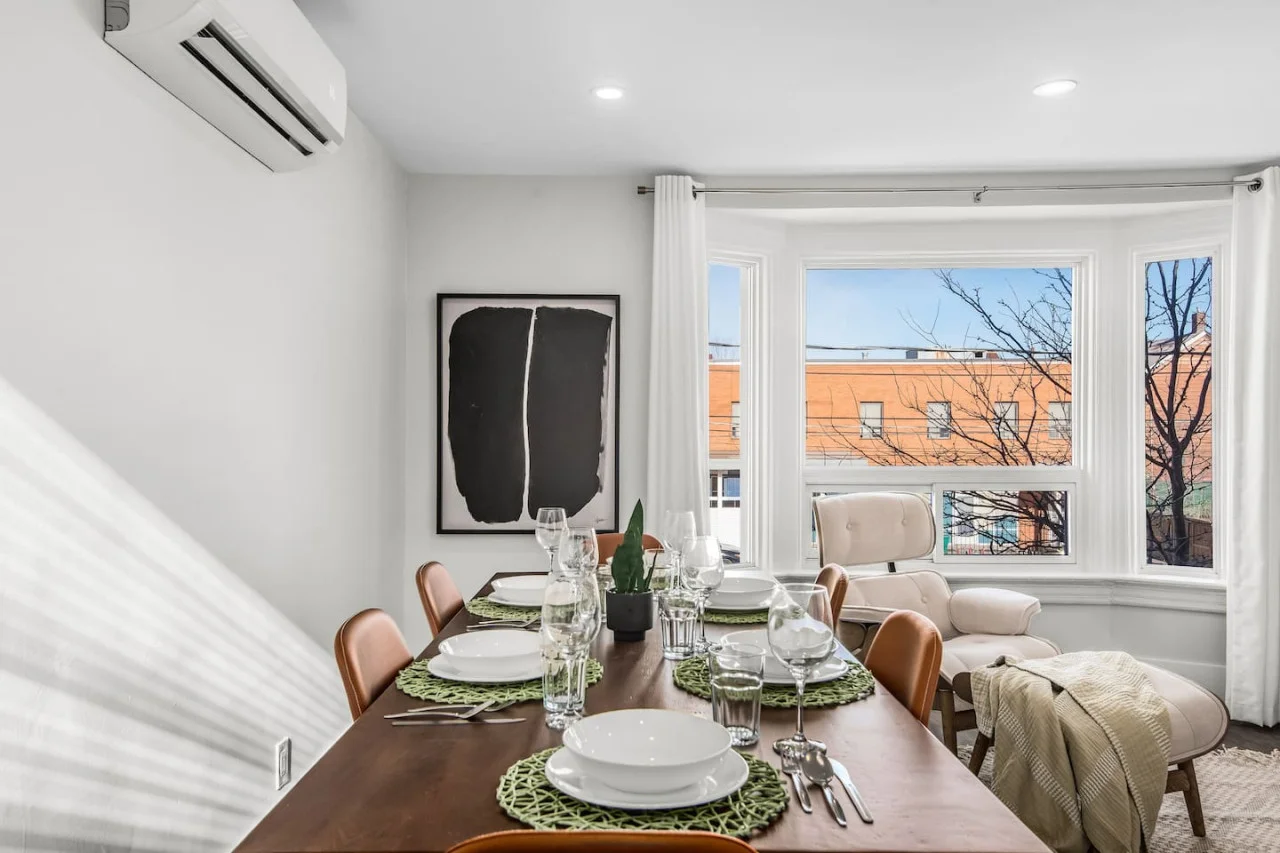 The dining room is bathed in natural light, creating a bright and inviting space where every meal feels special.