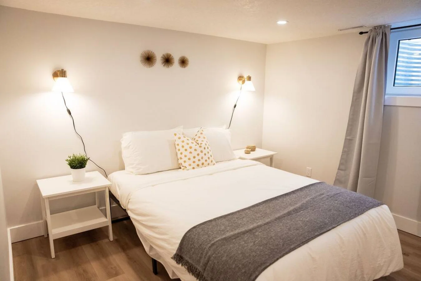 You feel enveloped in comfort as you relax on the queen bed, surrounded by a room designed for tranquility.