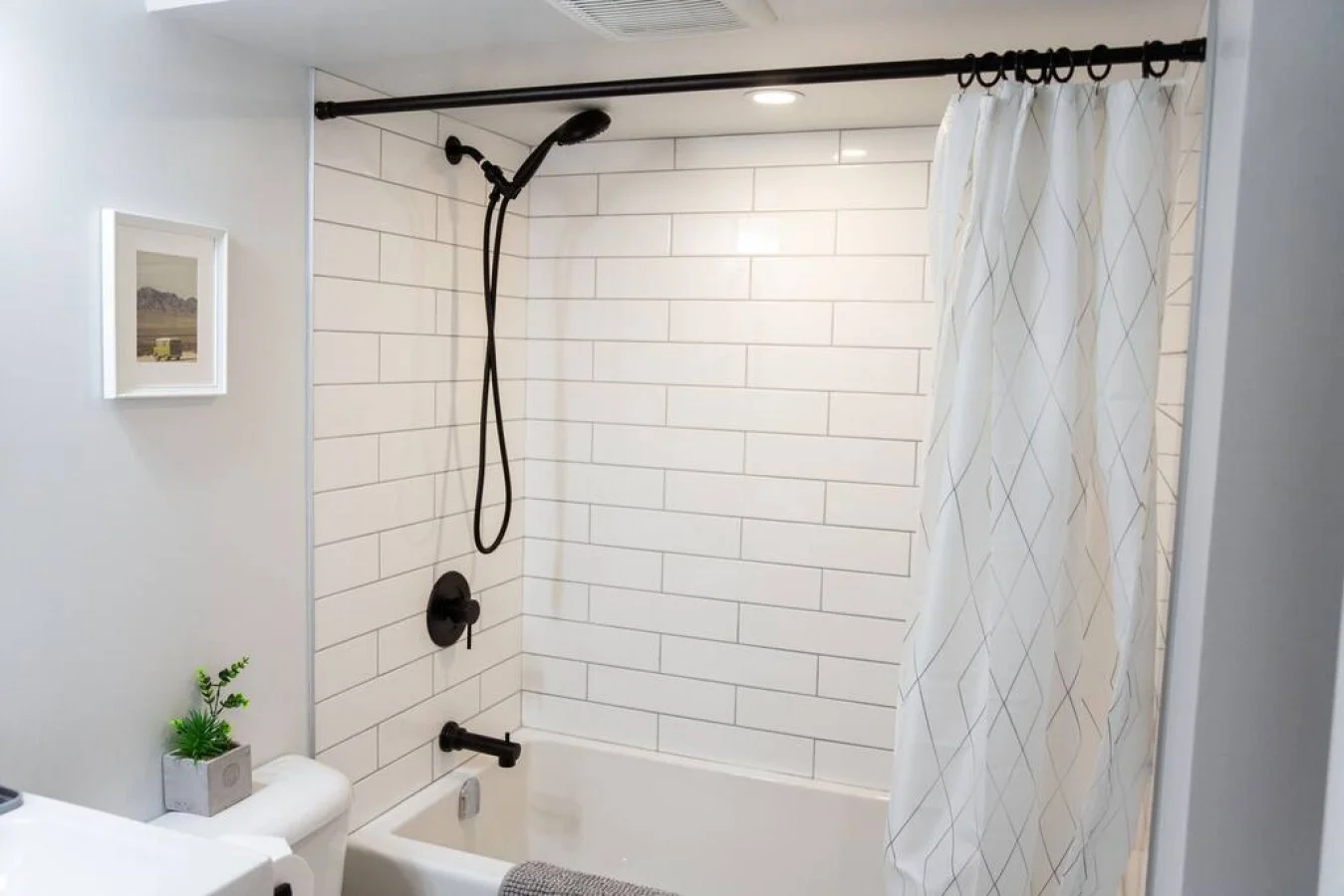 You feel a sense of calm as you enter the bathroom, where the thoughtful design and high-quality materials create a serene environment.