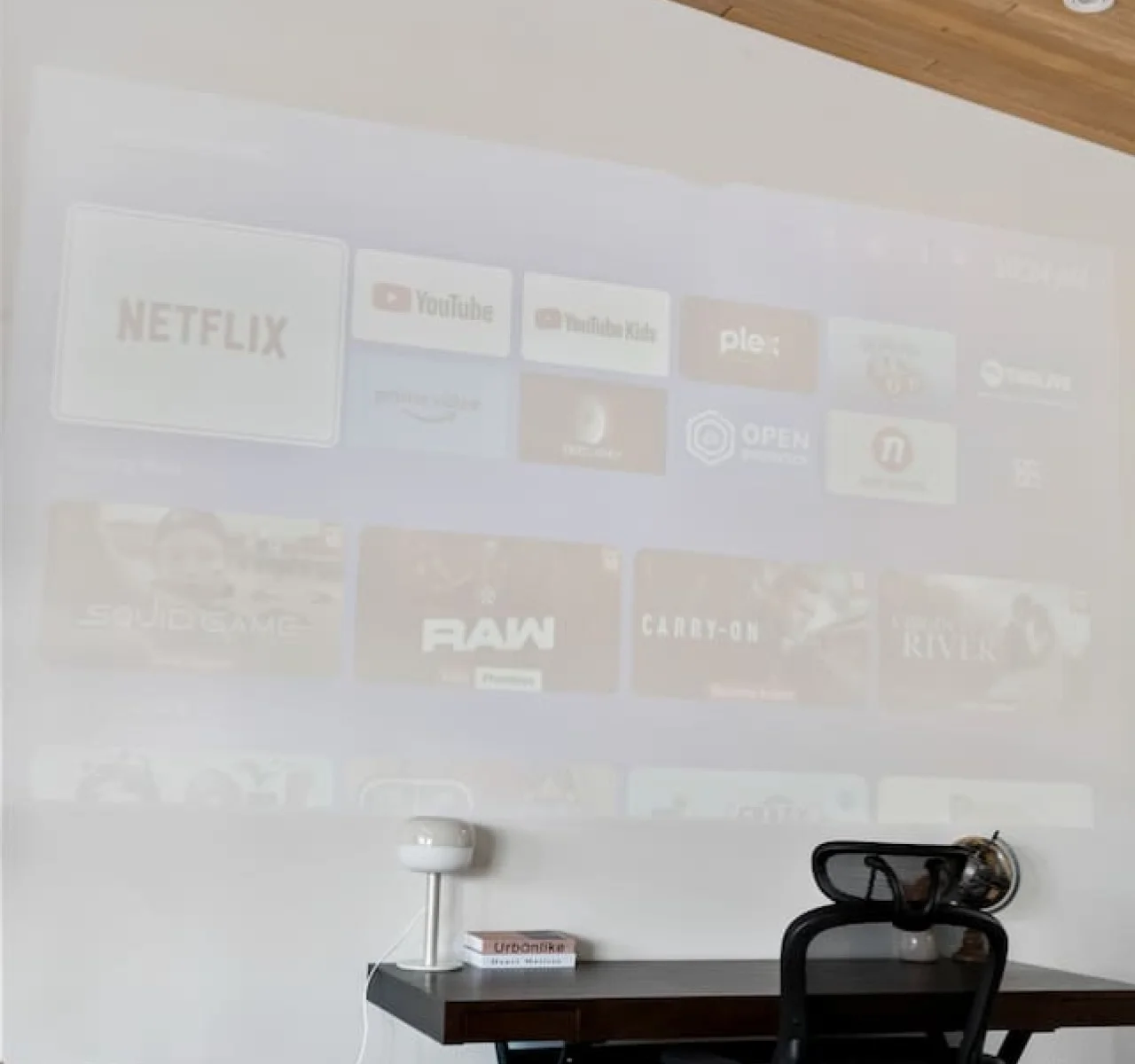 This cozy workspace with warm lighting, and a creative wall display, perfect for productivity.
