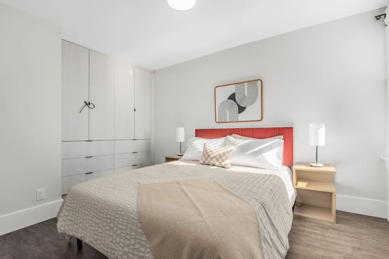 The bedroom’s serene ambiance invites you to relax, with a plush bed that promises a restful night's sleep.