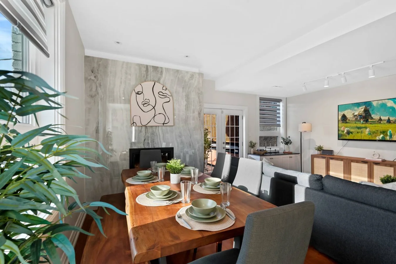 Elegant dining area with a large table and comfortable seating, perfect for gathering with family and friends for a meal.