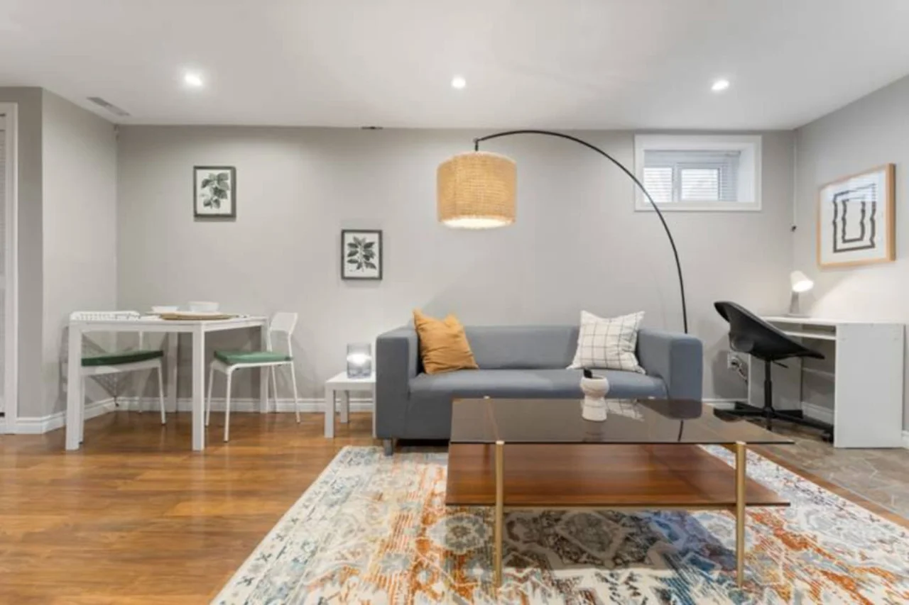 Relax in this warm, inviting space with wooden accents and cozy furnishings. You’ll love unwinding on the plush sofa, enjoying a good book or streaming your favorite shows in a serene atmosphere