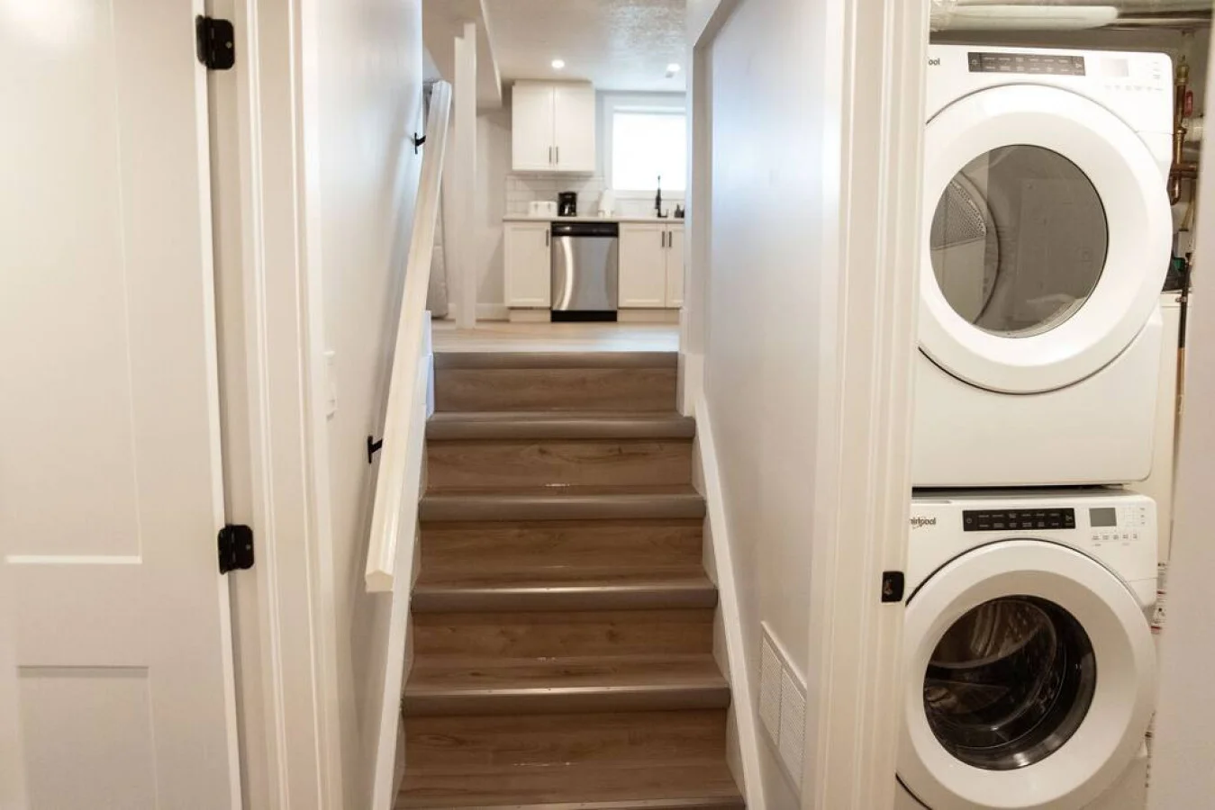 The staircase is a focal point of the home, with its graceful lines and stylish details adding to the overall charm.