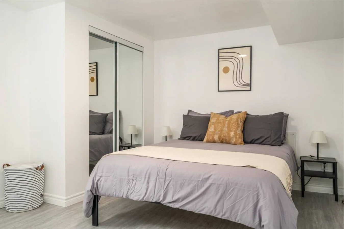 The bedroom’s serene ambiance invites you to relax, with a plush bed that promises a restful night's sleep.