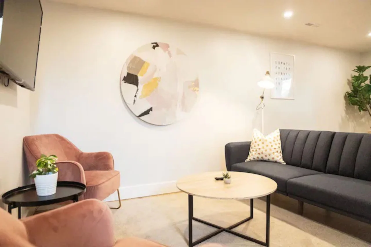 The living room is filled with natural light, creating a bright and welcoming space that invites relaxation.