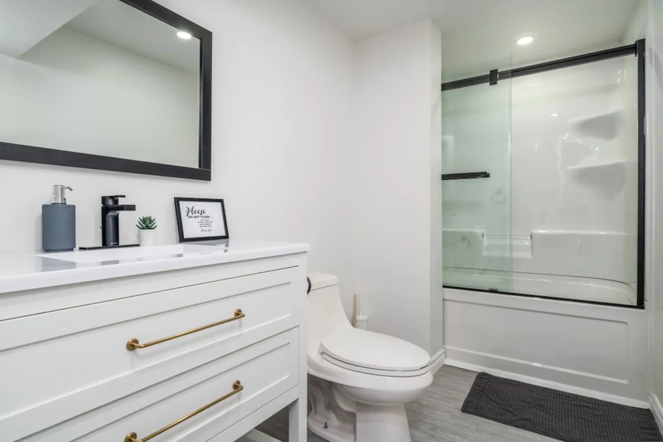 You feel a sense of calm as you enter the bathroom, where the thoughtful design and high-quality materials create a serene environment.