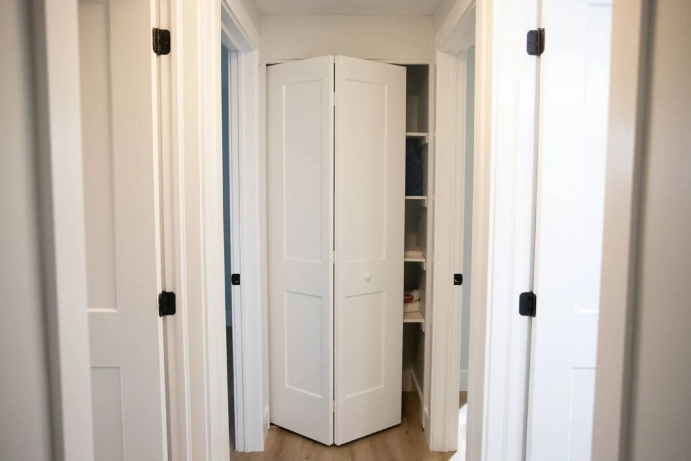 Tranquil bedroom with soft bedding and ample closet space, designed to ensure a restful night's sleep.