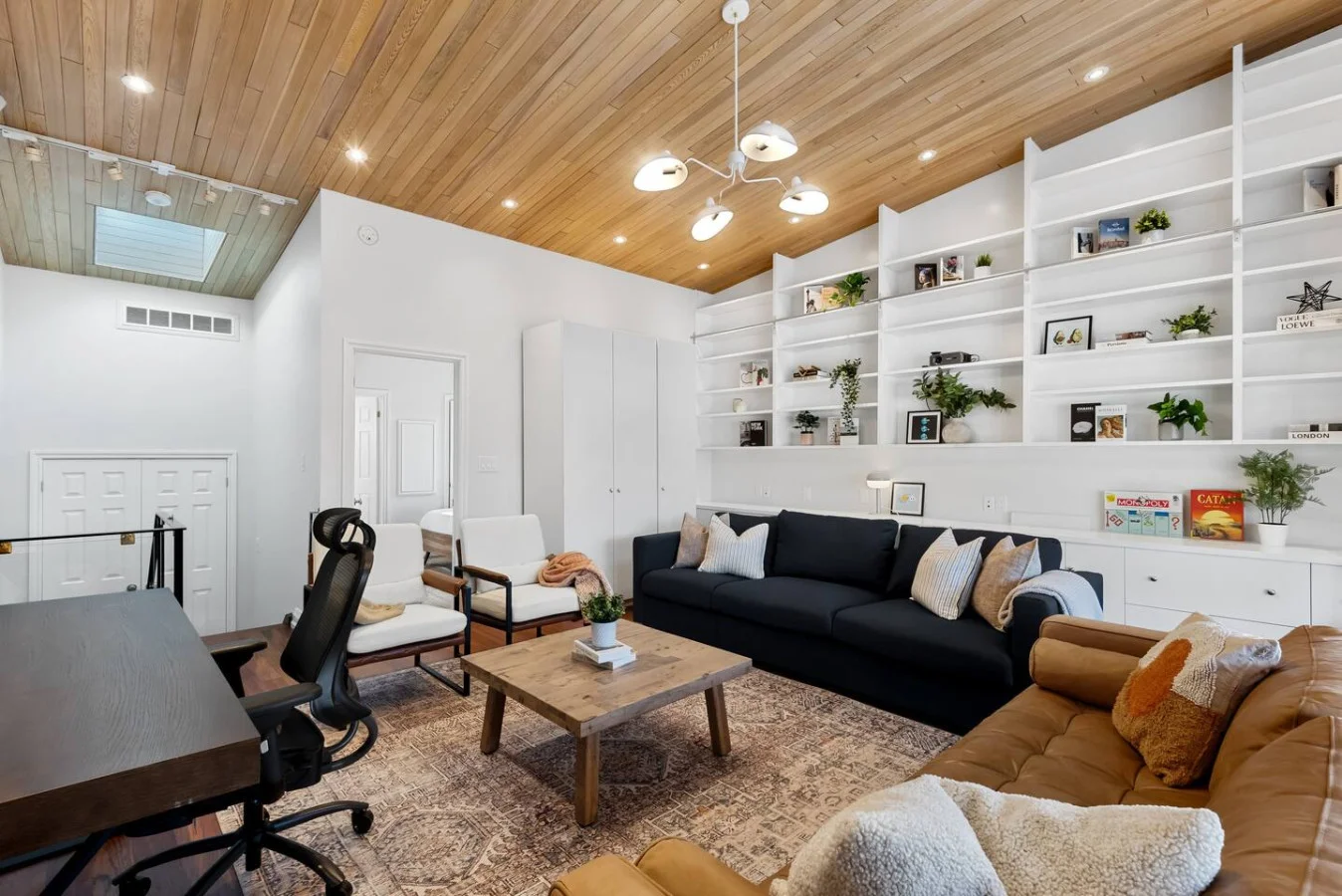 An open-concept area featuring a modern furnishings, and a stylish entertainment setup—ideal for gatherings and relaxation.