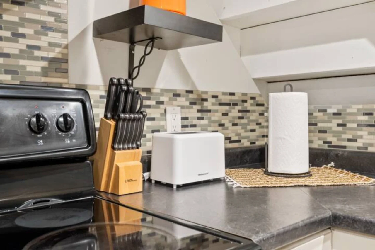 Fully equipped kitchen with all the tools you need for a perfect culinary experience. Enjoy the convenience of having everything at your fingertips!