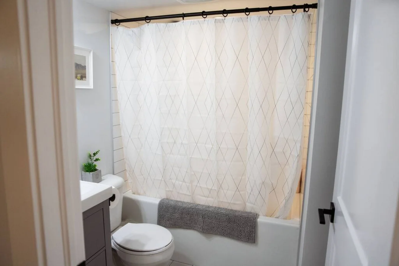 You feel a sense of calm as you enter the bathroom, where the thoughtful design and high-quality materials create a serene environment.