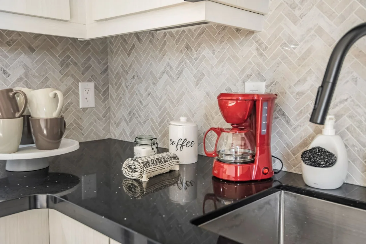 You’ll find a well-stocked coffee bar with an array of consumables such as specialty coffees inviting you to enjoy a relaxing beverage at any time.